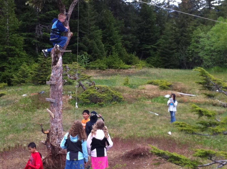 My son Aaron tests their homemade zip line